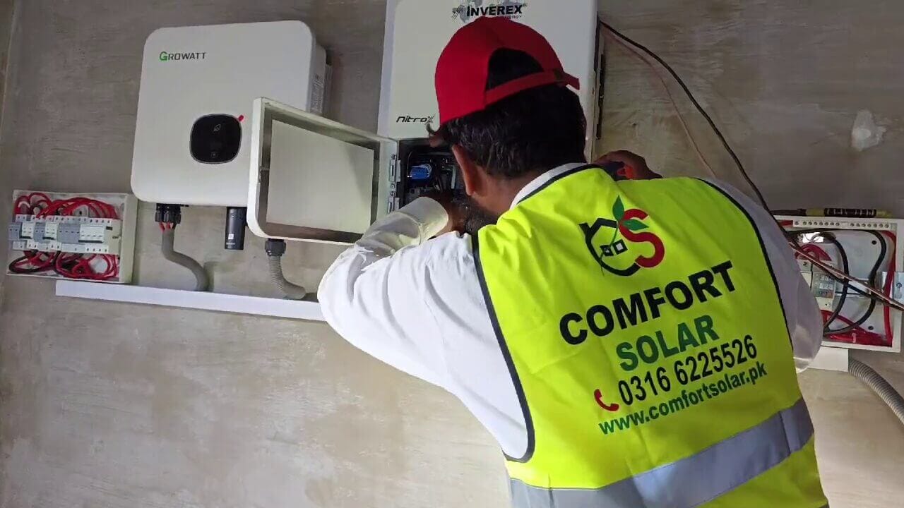 Comfort Solar technician installing a growatt solar inverter, part of a 21 kW Murree solar power system.