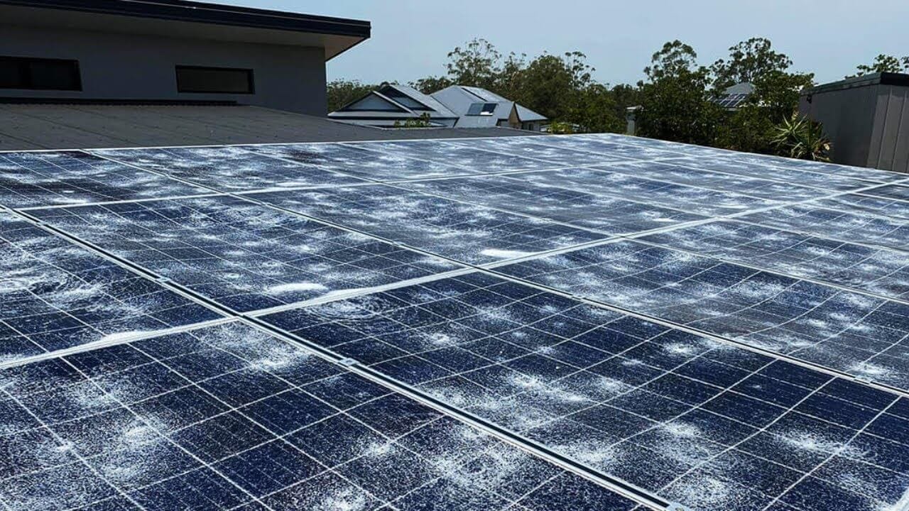 Solar panels covered in hail after a hailstorm in Pakistan. Protecting your solar panels from hail damage.