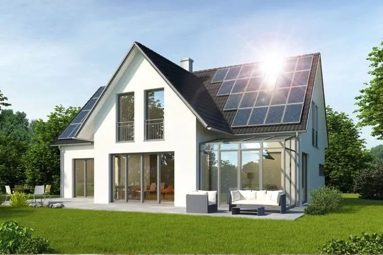 Modern house with solar panels installed on the roof, showcasing solar panel installation.