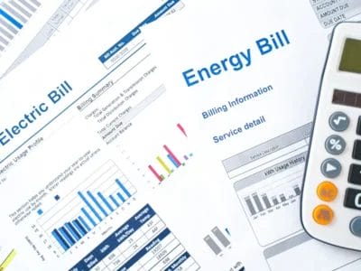 Understanding-Your-Electricity-Bill-Breaking-Down-the-Charges Energy bill with charts, graphs, and a calculator, relevant to solar panel installation costs.