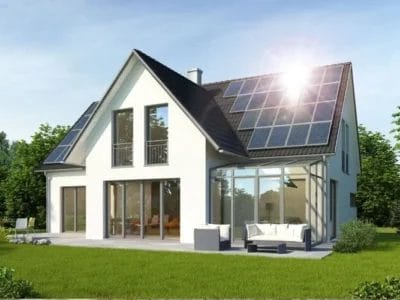 media_1c2e499cd3295be6f05c138c33d5d53ddc08a0cd9 Modern house with solar panels installed on the roof, showcasing solar panel installation.